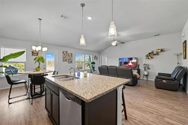 a kitchen with a table and chairs