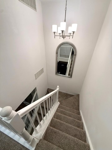 2298 Reflections Drive, Unit 2298 Aurora, IL 60502 - Photo 23 of 26 a view of entryway and hall with wooden floor