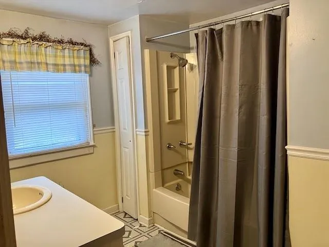 a view of a room with a green door and small yard