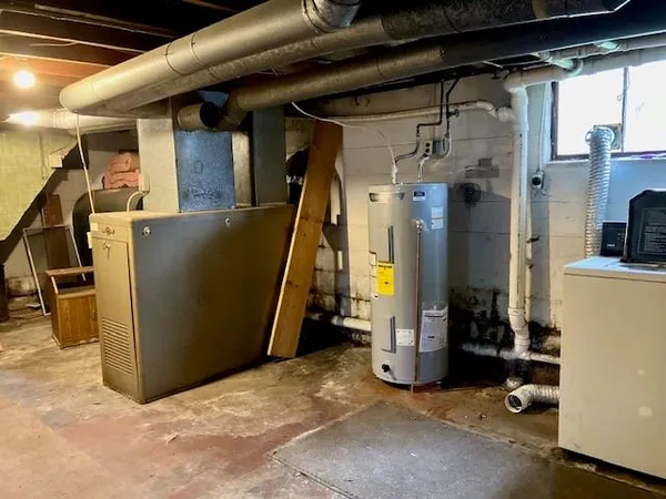 a utility room with a washing machine