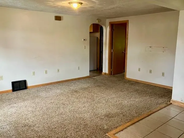 an empty room with a bench