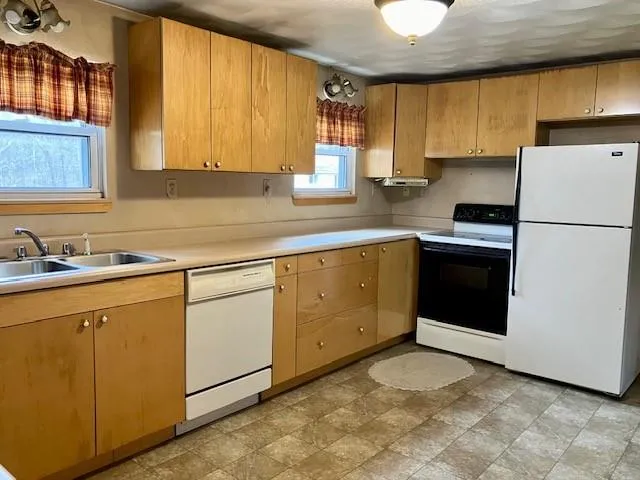 a bathroom with a shower curtain and a sink