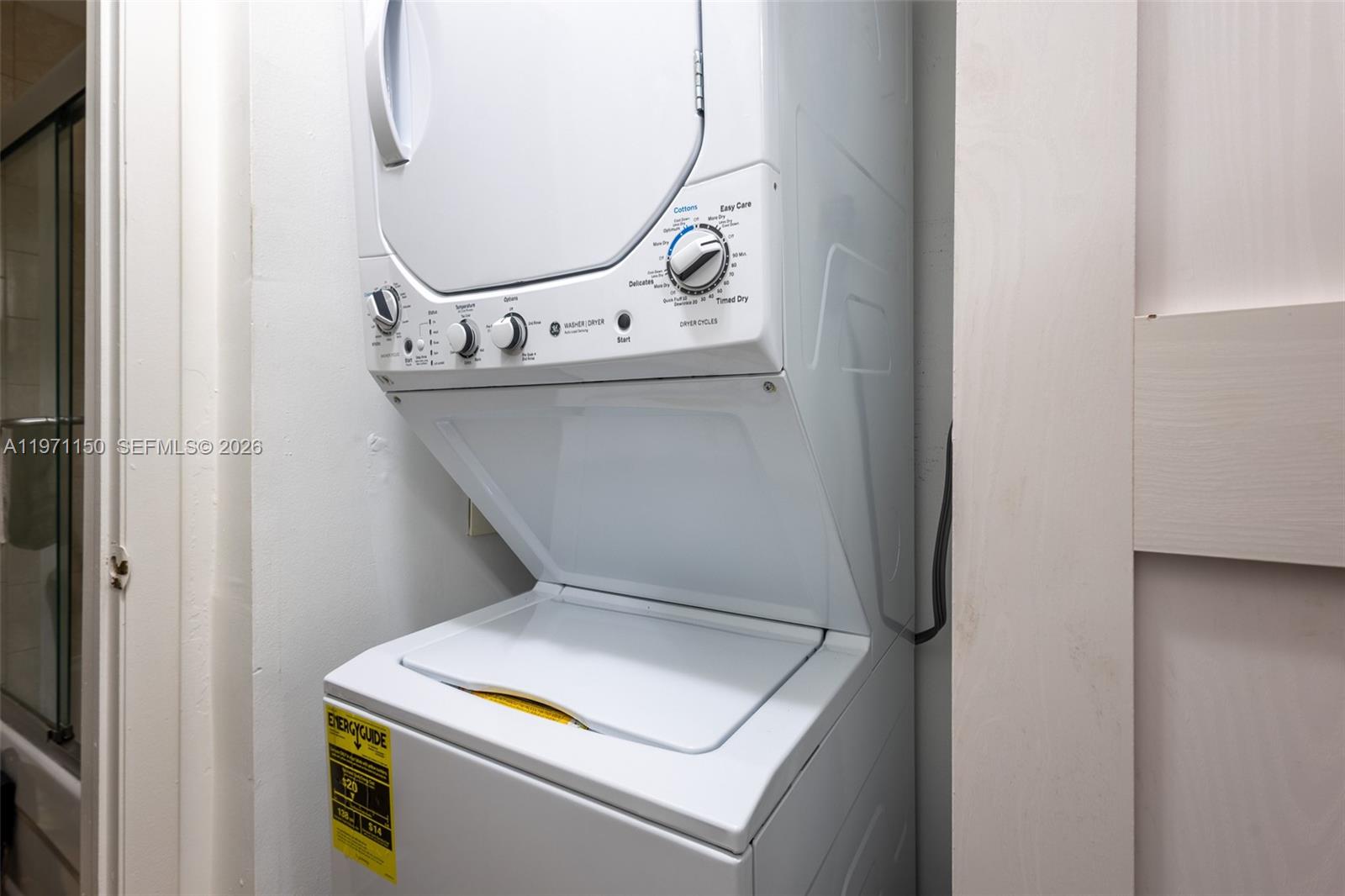 9430 Boca Cove Circle, Unit 210 Boca Raton, FL 33428 - Photo 14 of 24 a utility room with dryer and washer