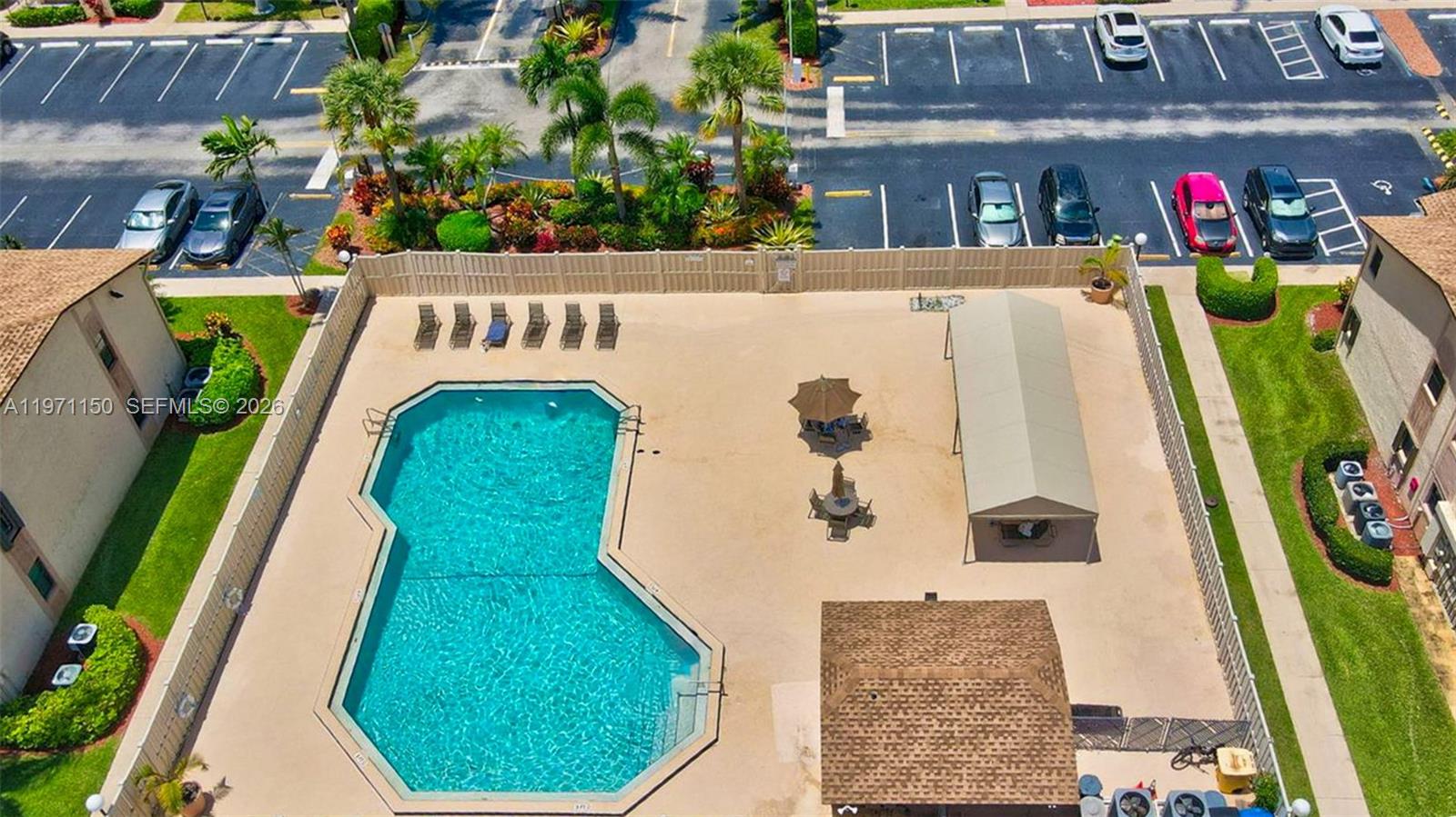 9430 Boca Cove Circle, Unit 210 Boca Raton, FL 33428 - Photo 24 of 24 a view of swimming pool in front of house