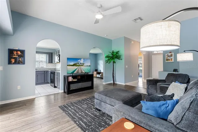 a kitchen with a refrigerator and a stove top oven