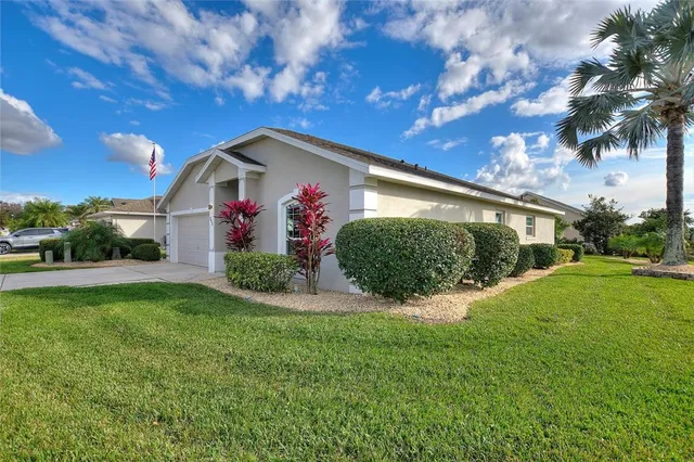 an aerial view of a house with a garden and plants