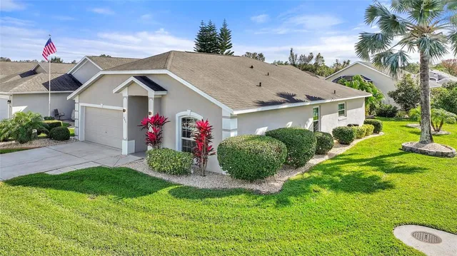 a view of a backyard with furniture and a fire pit