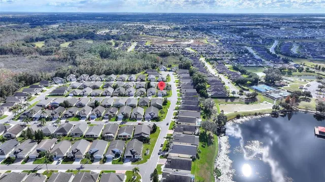 a building outdoor space with patio furniture and potted plants