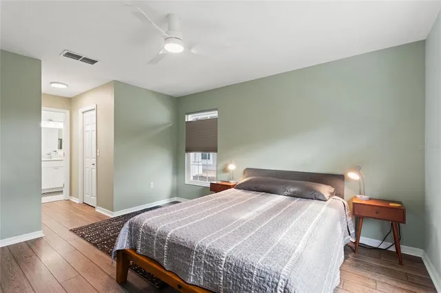 a bedroom with a bed and a lamp