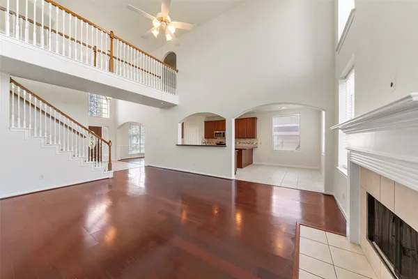 a living room with furniture a rug and a fireplace