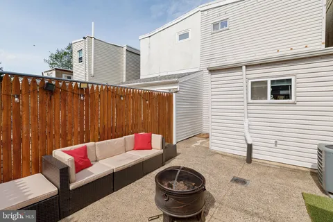 a outdoor space with patio couches and a potted plant