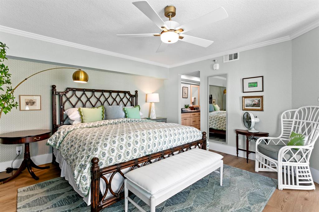 16332 Gulf Boulevard, Unit 3B Redington Beach, FL 33708 - Photo 12 of 93 a bedroom with a bed a table and chair