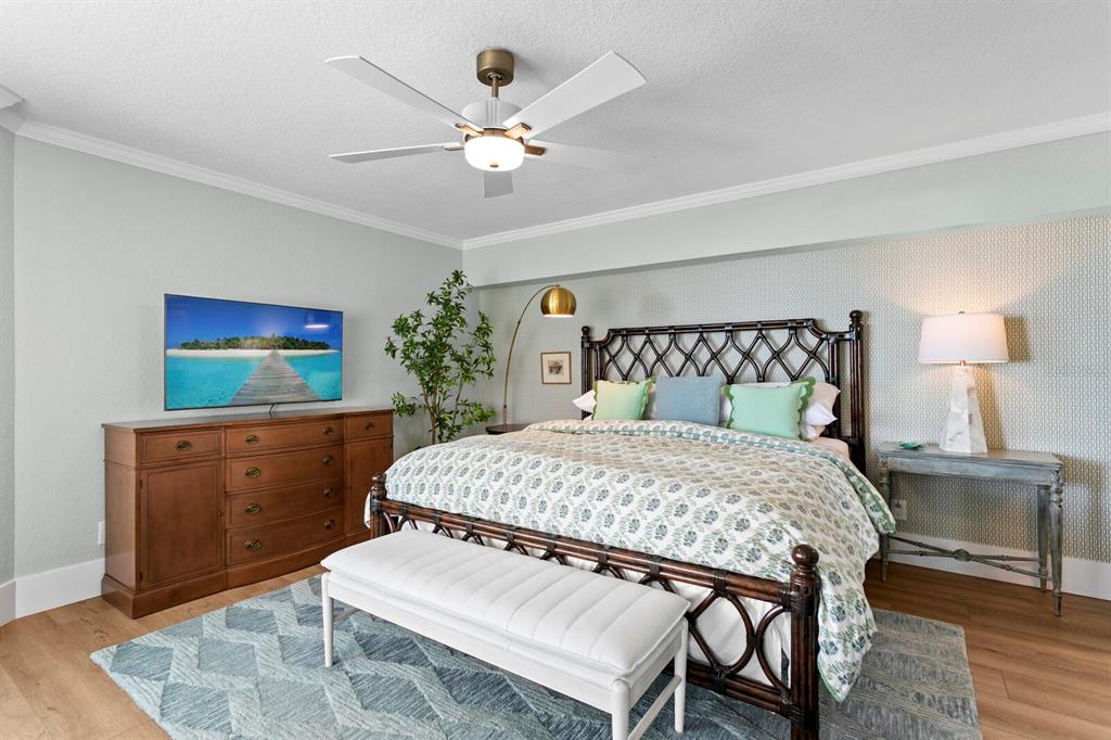 16332 Gulf Boulevard, Unit 3B Redington Beach, FL 33708 - Photo 13 of 93 a bedroom with a bed and a mirror on dresser