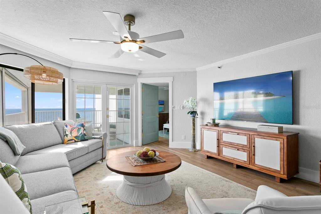 16332 Gulf Boulevard, Unit 3B Redington Beach, FL 33708 - Photo 30 of 93 a living room with furniture and a large window