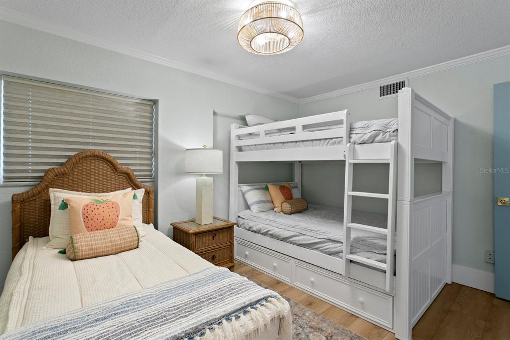 16332 Gulf Boulevard, Unit 3B Redington Beach, FL 33708 - Photo 40 of 93 a bedroom with bed and window