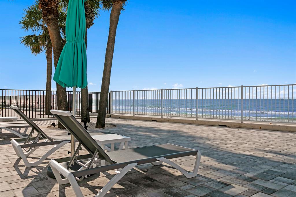 16332 Gulf Boulevard, Unit 3B Redington Beach, FL 33708 - Photo 55 of 93 a view of a terrace with wooden floor and fence