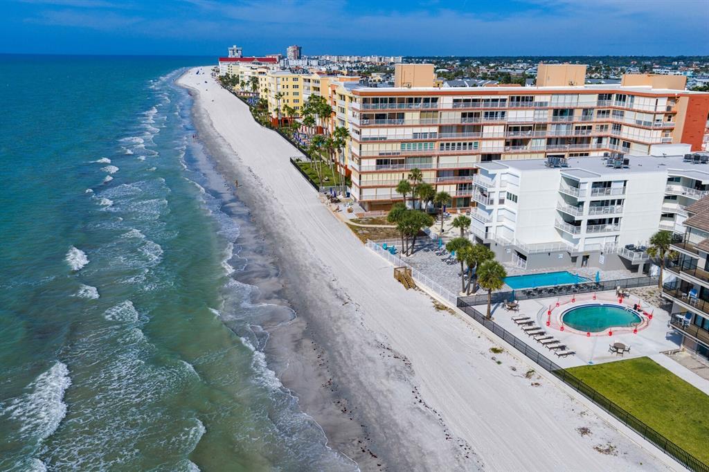 16332 Gulf Boulevard, Unit 3B Redington Beach, FL 33708 - Photo 80 of 93 a view of a balcony with a floor to ceiling window and an outdoor seating