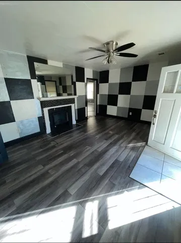 a view of a livingroom with furniture and wooden floor