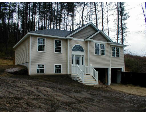 24 East Rindge Road Ashburnham, MA 01430 - Photo 1 of 1 a front view of a house with a yard
