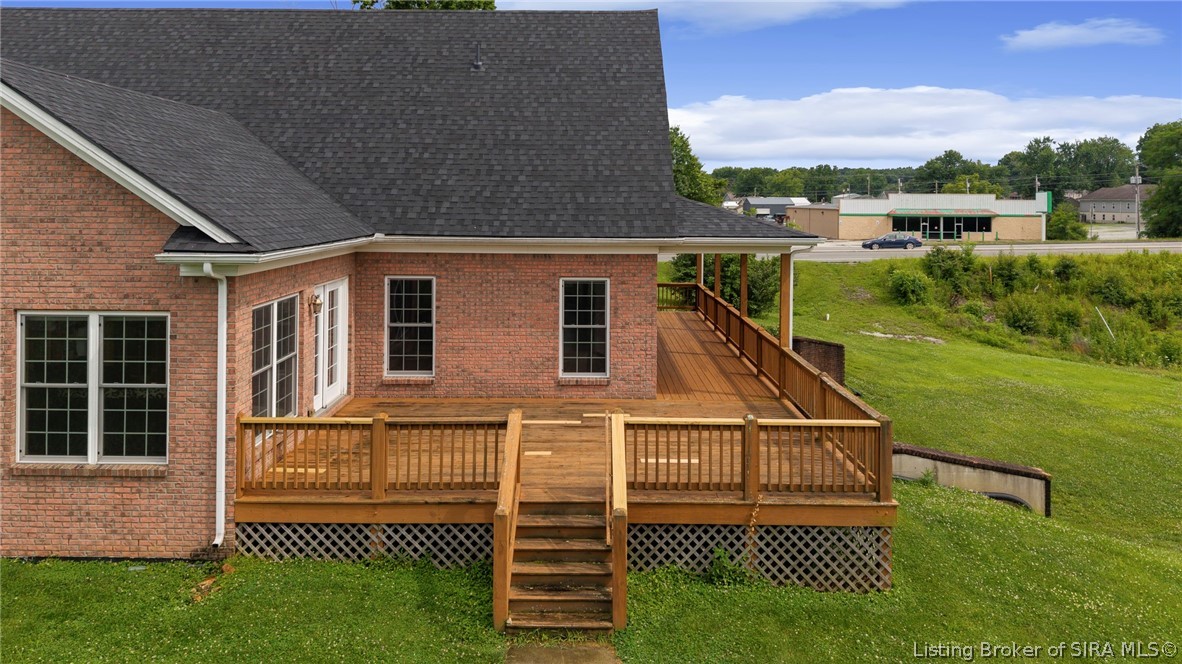 213 Colonels Way Henryville, IN 47126 - Photo 5 of 64 Back and Side Deck with access to Sunroom and 2 main floor bedrooms