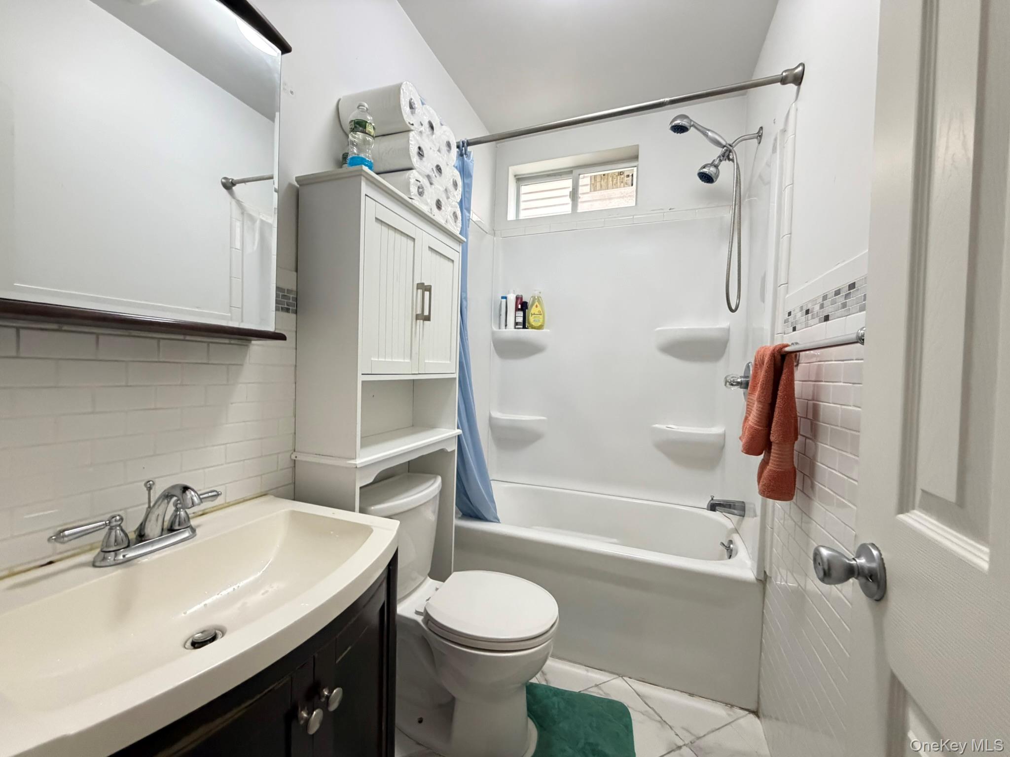 100-04 Spruce Street Queens, NY 11368 - Photo 5 of 12 a bathroom with a sink toilet and shower