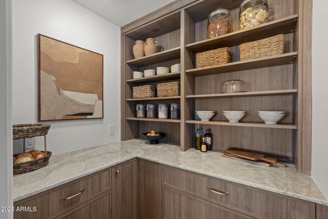 a kitchen with a sink a counter space and a window