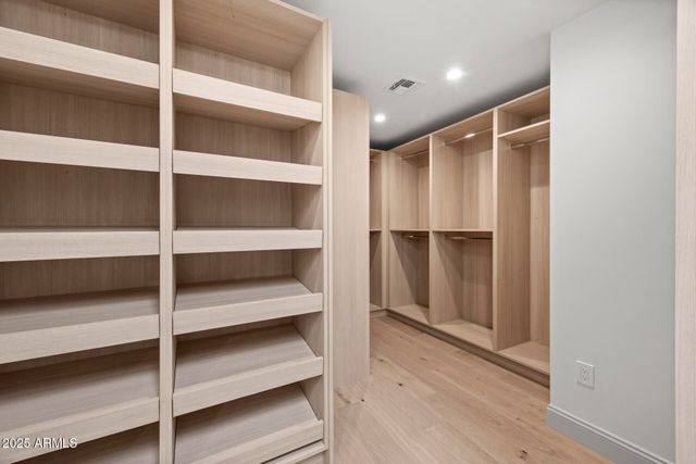 a view of an empty walk in closet