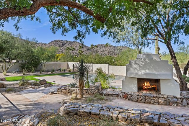 a view of a swimming pool with a lawn chairs