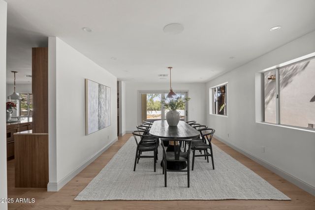 a dining room with furniture and window