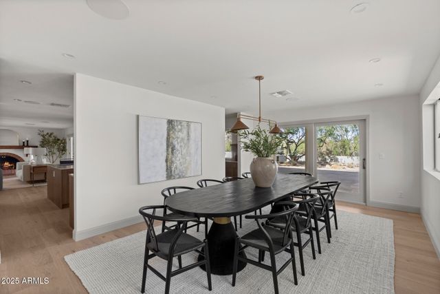 a dining room with furniture and window