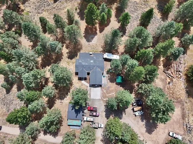an aerial view of a house with outdoor space
