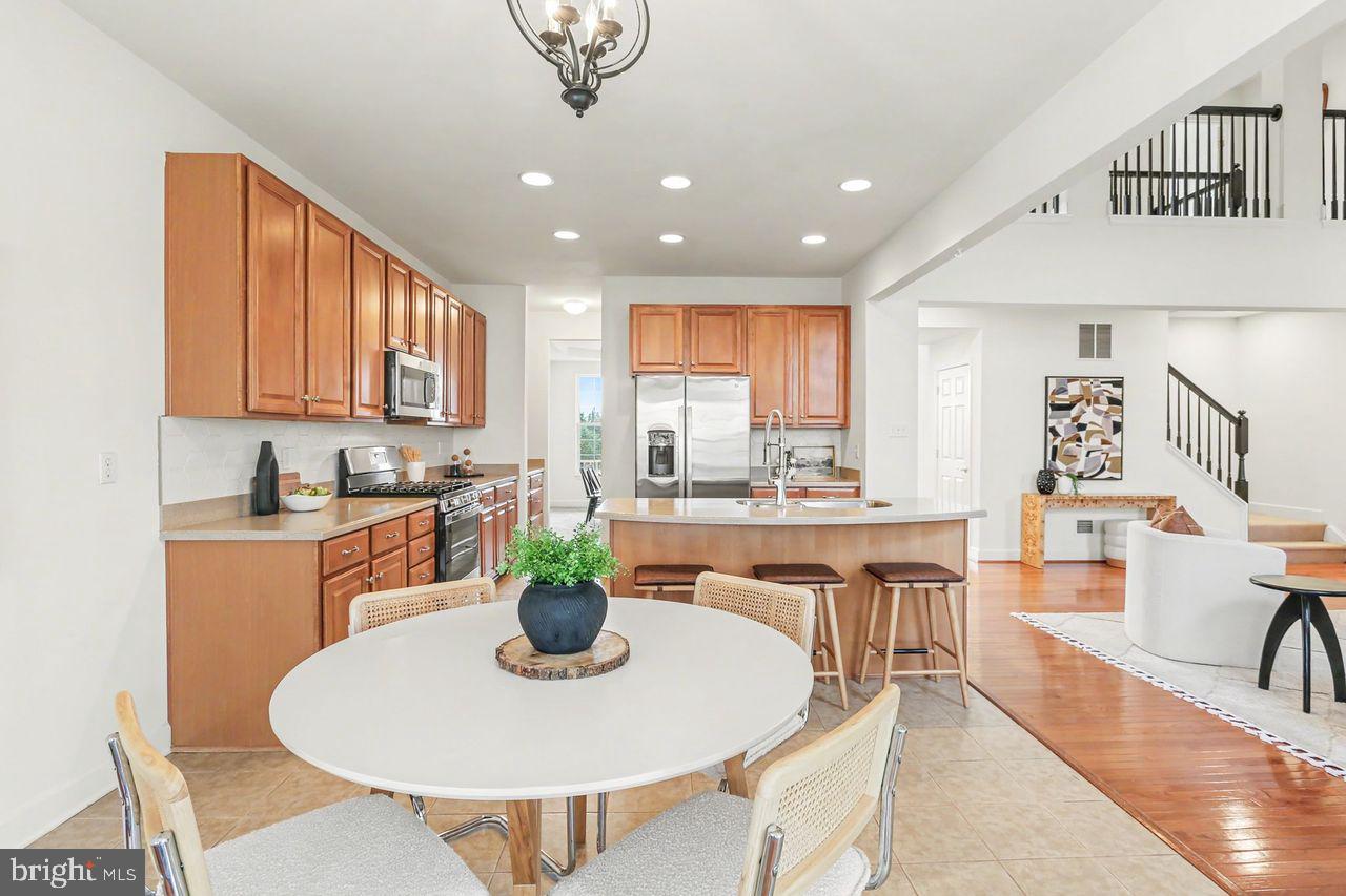35 Vista Loop Hanover, PA 17331 - Photo 12 of 37 a dining room with furniture a chandelier and kitchen view