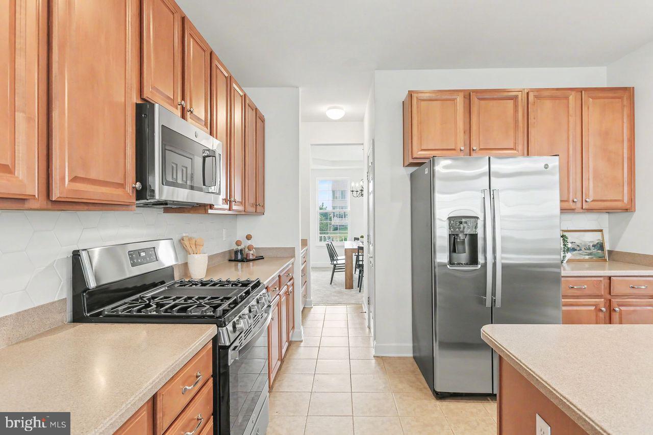 35 Vista Loop Hanover, PA 17331 - Photo 13 of 37 a kitchen with stainless steel appliances granite countertop a refrigerator a stove and a sink