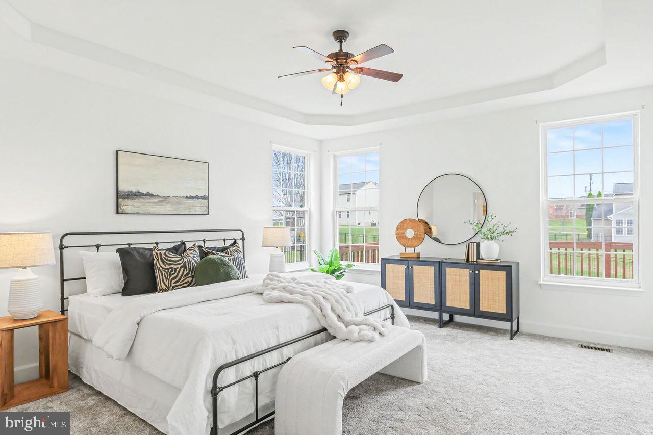 35 Vista Loop Hanover, PA 17331 - Photo 20 of 37 a bedroom with a bed a dresser and large windows