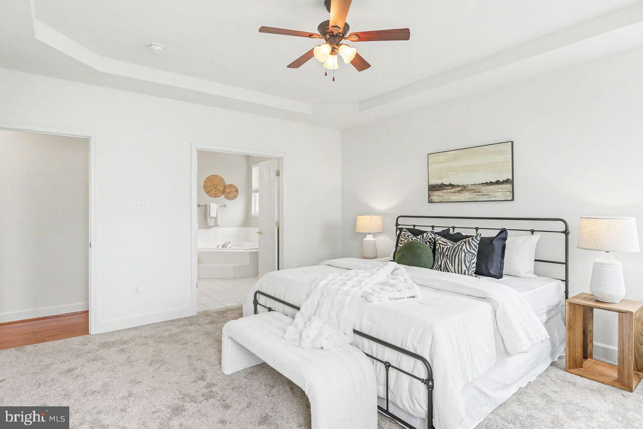 35 Vista Loop Hanover, PA 17331 - Photo 21 of 37 a bedroom with a bed and a painting on the wall