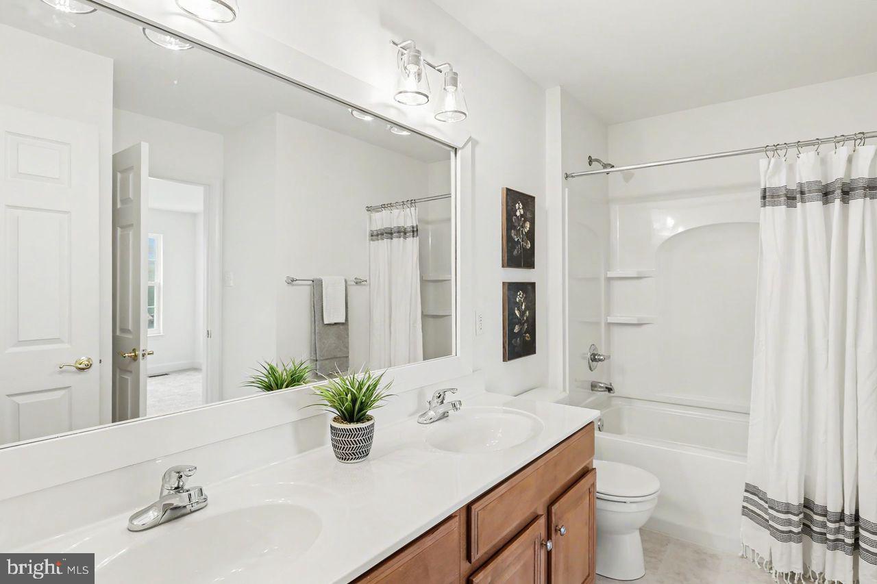 35 Vista Loop Hanover, PA 17331 - Photo 22 of 37 a bathroom with a sink a toilet and shower