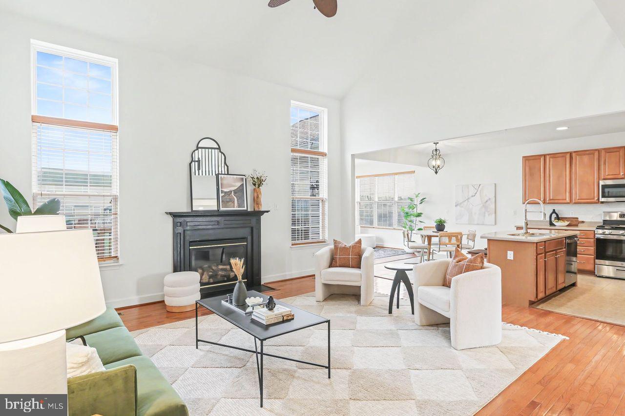 35 Vista Loop Hanover, PA 17331 - Photo 10 of 37 a living room with furniture a fireplace and large windows