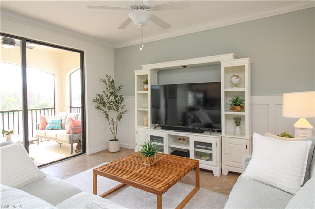 9554 Trevi Court, Unit 4737 Naples, FL 34113 - Photo 20 of 49 a living room with furniture and a flat screen tv