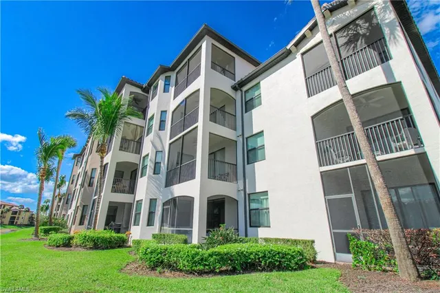 a outdoor living space with furniture and a fireplace