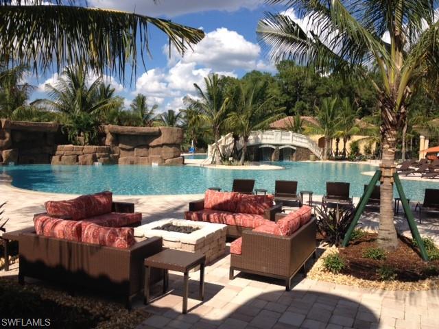 9554 Trevi Court, Unit 4737 Naples, FL 34113 - Photo 45 of 49 a outdoor living space with furniture and a fireplace