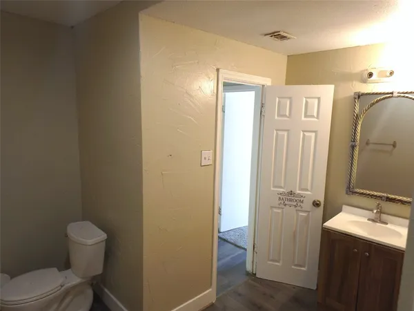 a bathroom with a sink and toilet