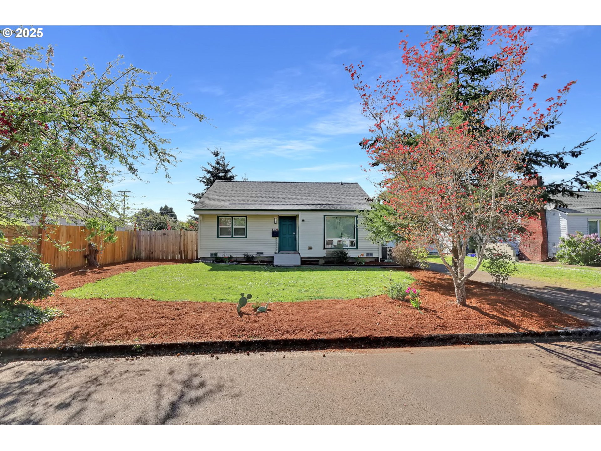 830 Jerry Street Eugene, OR 97402 - Photo 2 of 22 a front view of a house with a yard and garage