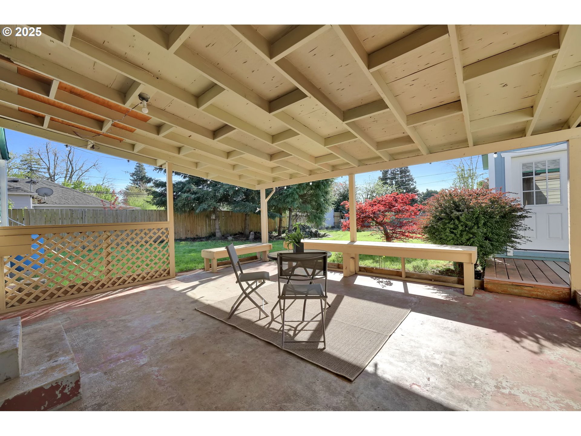 830 Jerry Street Eugene, OR 97402 - Photo 21 of 22 a view of a patio with a table and chairs with wooden floor