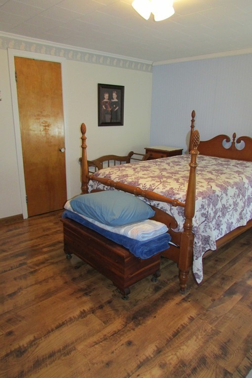 75 Stage Road Westhampton, MA 01027 - Photo 19 of 30 a bedroom with bed and wooden floor