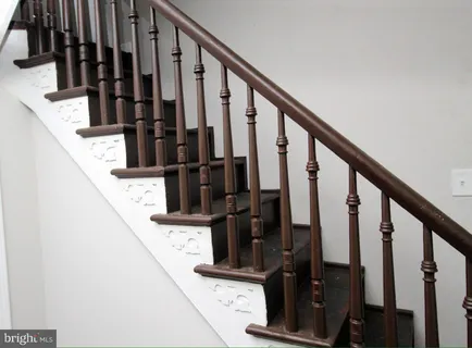 a view of stairs with wooden floor
