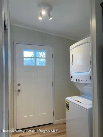 a bathroom with a sink a mirror a vanity and a shower