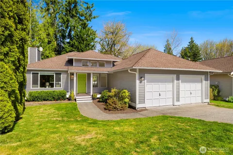 a front view of a house with a garden and porch