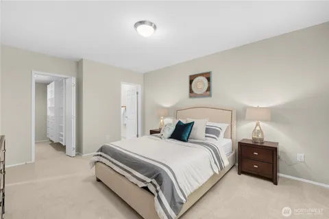 a bedroom with a bed and a cabinets