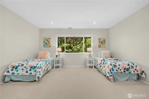 a bedroom with a bed and a couch