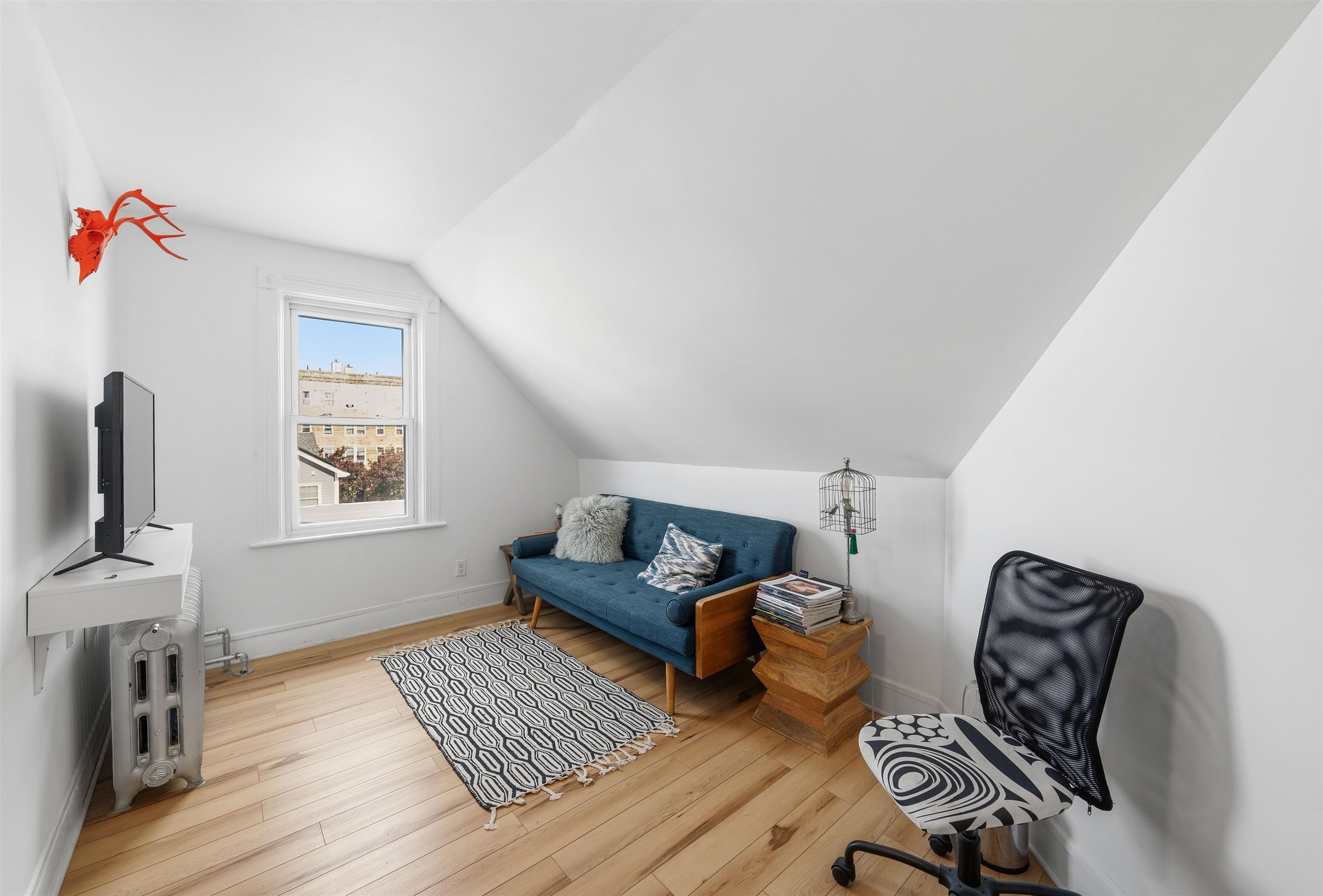124 73rd Street, Unit 3 North Bergen, NJ 07047 - Photo 2 of 14 a living room with furniture and a flat screen tv